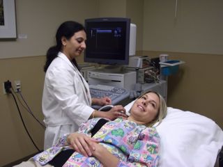 Vijaya Vangala (left) performing ultrasound on Laura Staats. Ultrasound is one way to diagnose DVT. Credit:Theresa Birk.